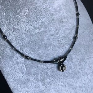 Black beaded necklace with clear crystals.